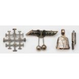 A Russian silver and niello broch, 84 standard, 58mm and silver whistle, Birmingham 1895, a bell,