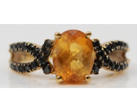 A 9ct gold citrine and blue gemstone dress ring, 9mm x 6mm citrine, K, 2.9g