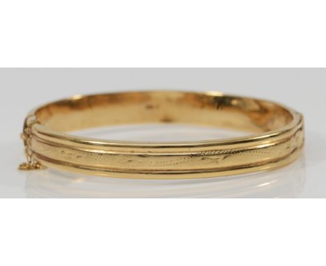 A 9ct gold hinged bangle, London 1982, 8 x 58 x 56mm, 10gm, slightly mis-shaped