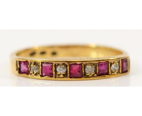 A 9ct gold ruby and brilliant cut diamond half eternity ring, M, 1.7g