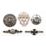 A Scottish silver Luckenbooth brooch, by MG, Glasgow and four other Celtic silver brooches, 36gm