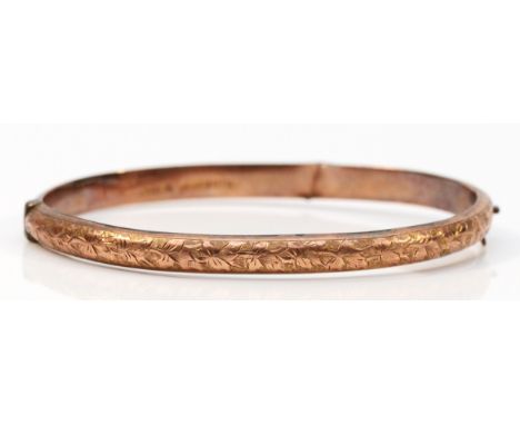 An Edwardian 9ct rose gold hinged bangle, Birmingham 1906, engraved front, damaged back, 60 x 49mm, 5.8gm