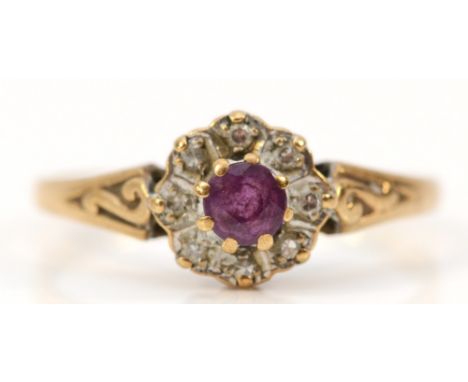 A 9ct gold ruby and diamond cluster ring, K, 1.3g