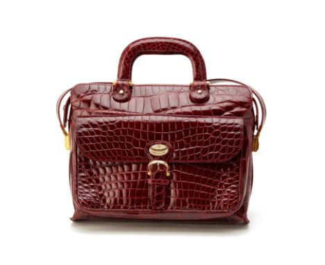A 'JARDIN DES SACS' VINTAGE BURGUNDY CROCODILE HANDBAG
With detachable shoulder strap and external front flap
Jardin Des Sacs