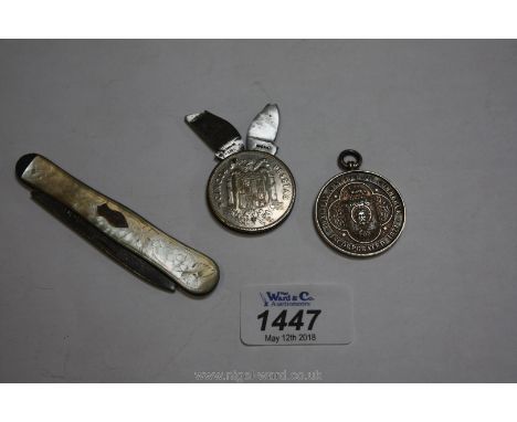 A pesetas coin knife and file, chamber of commerce medal and a silver and mother of pearl folding knife