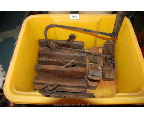 A box of vintage Carpentry tools including deep scroll saw, two wooden jack Planes and seven moulding Planes