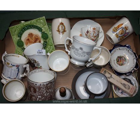 A quantity of commemorative china including two coronation teapot stands and various mugs and trinket dishes
