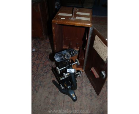 A Bactil Binocular Microscope by Watson London with case and Watson Barnet Light