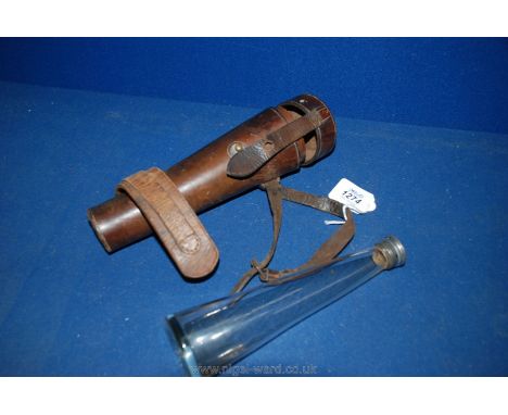 An old leather Hunting Saddle Flask holder with fitted conical shaped glass bottle