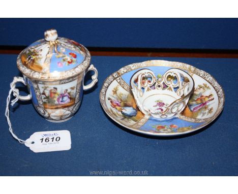 An 18th c. two handled, lidded Chocolate Cup and trembleuse saucer with hand painted scenes and flowers (saucer basket damage