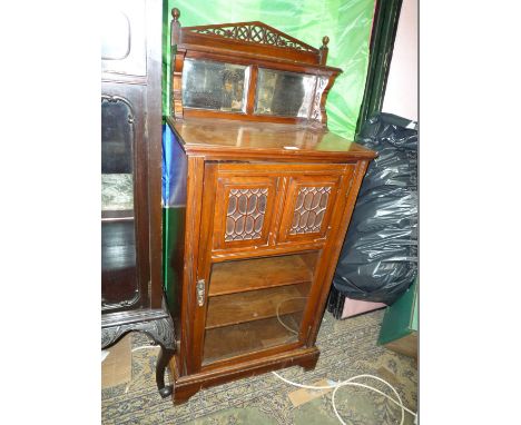 A small circa 1900 Walnut Hall Cupboard having upstand back with gallery, shelf and two small mirrors, single door with two c