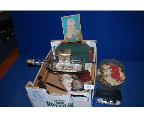 A quantity of miscellanea including playing cards, ship in bottle, carriage clock (as found), tin of old keys, etc.