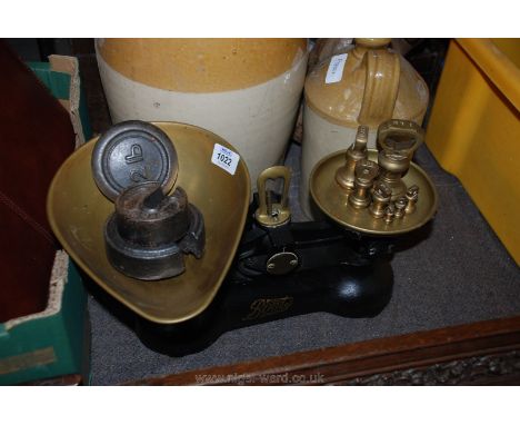 A set of Boots Nottingham Scales, brass pans and seven bell shaped weights together with three miscellaneous weights