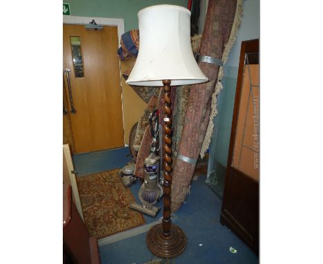 A 1940's oak barley twist Standard Lamp on circular base with shade