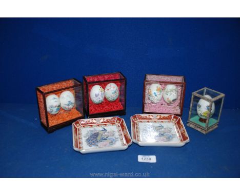 Four sets of Oriental decorated eggs and two Oriental trinket dishes