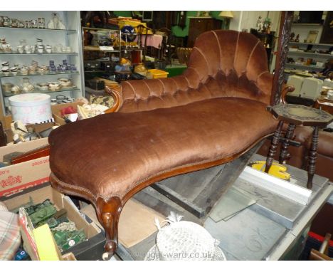 A Victorian Mahogany show frame, button back Chaise Longue with scroll supports and stylised cabriole legs with scroll feet, 