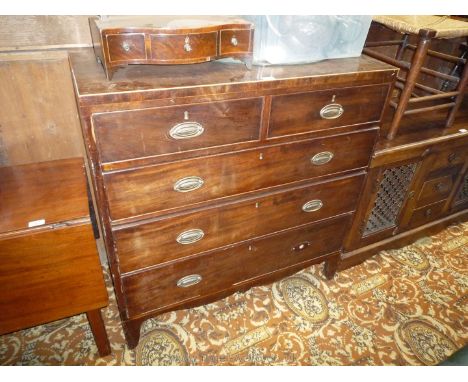 A mid 19th c. Mahogany Chest of two short over three long graduated Drawers, strung edge top over the five Pine lined drawers