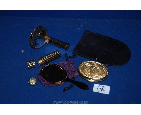 An Estee Lauder compact together with a Stratton small compact mirror and lipstick holder and a Basis 17 jewels Swiss made, e