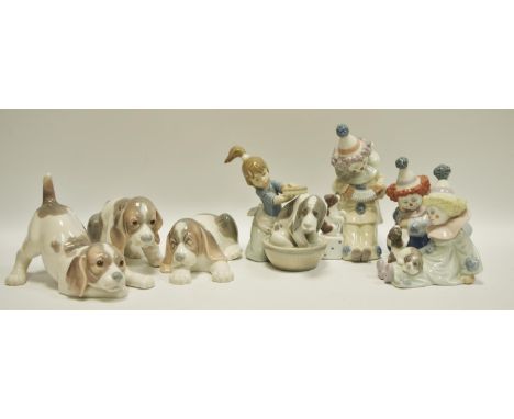 Lladro - seven examples, including a girl bathing her dog, printed marks to base impressed pattern 5455; three clowns with pu