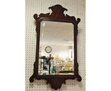 A early 19th century mahogany Vauxhall mirror; a contemporary three panel dressing table mirror; another (3)