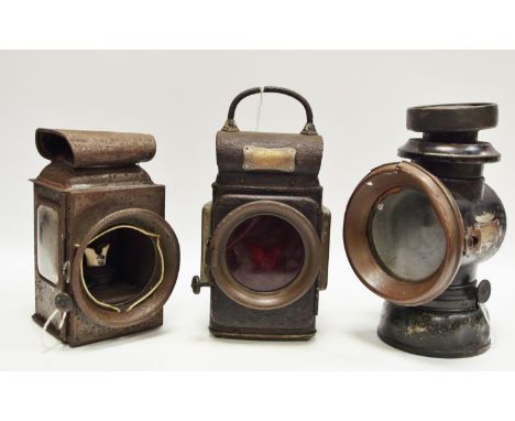 A Lucas C332 sentry oil lamp; a Lucas No F141 long's own oil lamp; another (3)