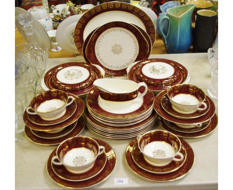A Midwinter part dinner service comprising two tureens, meat plate, gravy boat, dinner plates,side plates, soup bowls and sau