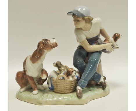 Lladro - A Lladro figure group of a boy with dog and puppies, stamped 5376, boxed 
