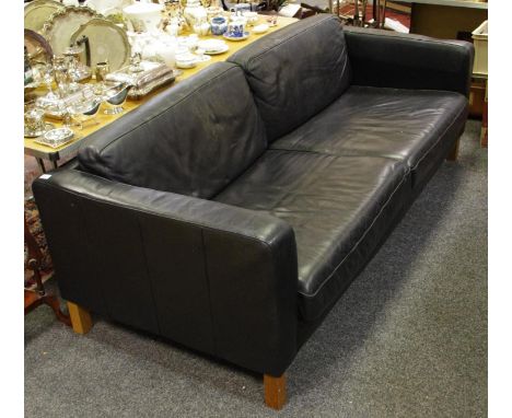A black leather executive office sofa.
