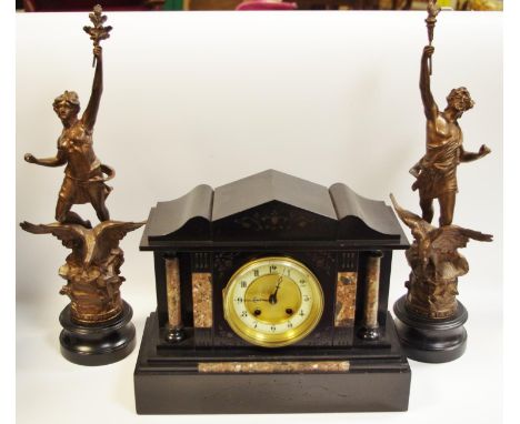 A 19th century Belge noir mantel clock; a near pair of spelter garnitures (3)