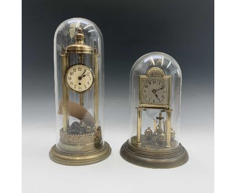 A German brass 30 day torsion clock of portico form with five column supports, the movement stamped DRGM 558490, under a glas