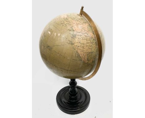 A Philips 19 inch terrestial globe on turned ebonised stand with circular base. Overall height 75cm.Condition report: Various