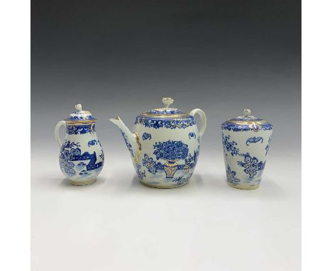 A late 18th century Worcester porcelain 'Bat' pattern teapot, tea caddy and cover, and lidded jug, each having pseudo Chinese