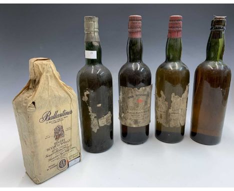 A vintage bottle of Ballantine's finest Scotch Whisky, retaining original tissue wrapper, together with four bottles of 'Red 