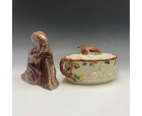 A pottery game tureen and cover, probably Minton, circa 1900, the cover with partridge finial, moulded with rabbits in bracke