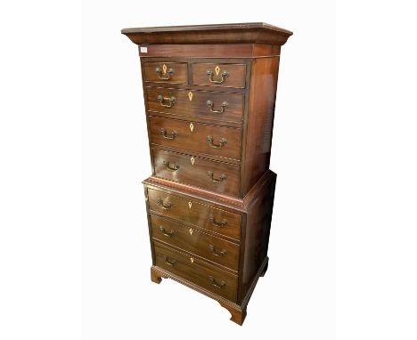 A George III style mahogany chest on chest, of small proportions, with two short and six long graduated drawers, on bracket f