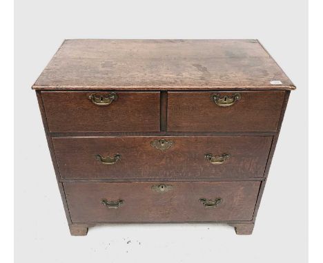 A George III oak chest of drawers, with two short and three long drawers on bracket feet, height 83cm, width 88cm, depth 43cm