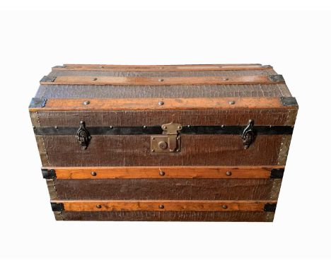 A metal bound wooden dome top steamer trunk, height 51cm, width 76cm, depth 44cm, together with a painted tin trunk (2).