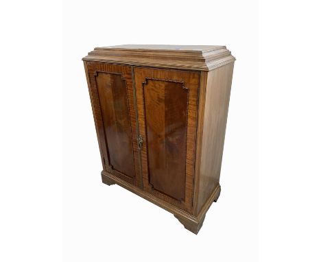 A George III style mahogany side cabinet, early 20th century, with a pair of panelled doors, on bracket feet, height 100cm, w