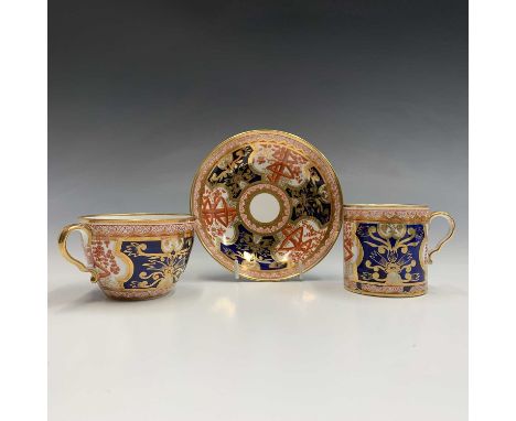 A Spode porcelain trio, circa 1810, painted in iron red, blue and gilt with the Dollar pattern, number 715, the saucer 13.5cm