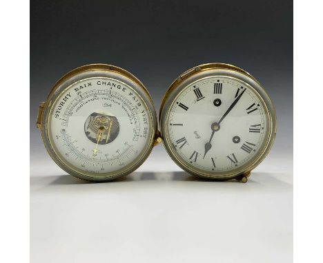 A German bulkhead type ships clock and barometer, by Schatz, diameter 18cm (2)