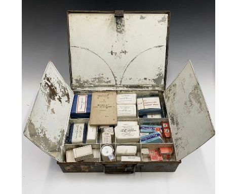 A British Railways black painted tin first aid outfit, with hinged compartments containing some original contents and an acci