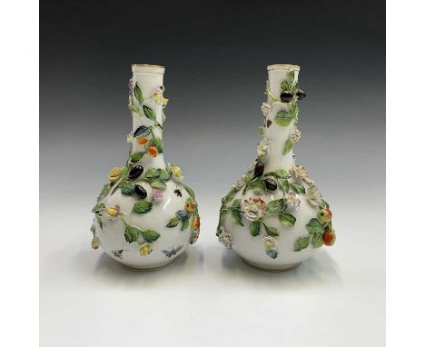 A pair of Dresden porcelain vases, probably Carl Thieme, of shaft and globe form, moulded in high relief with fruit and flowe