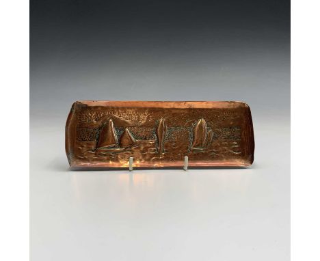 A Newlyn Industrial Class copper pen tray, repousse decorated with sailing boats. 7.25cm x 20cm.