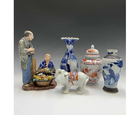 A Chinese crackleglaze blue and white vase, 20th century, painted figures in a garden, height 18cm, together with a Japanese 
