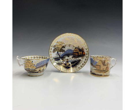 A Coalport cup and saucer, painted and gilt in imari colours with figures beside a bridge and a cottage, the saucer 14cm diam