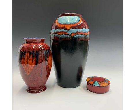 A Poole pottery limited edition Millennium vase, height 34cm, together with a similar smaller vase and a lidded pot (3).