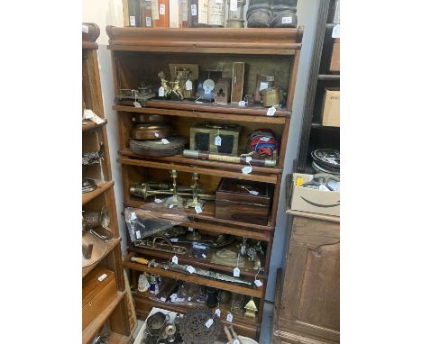 A Globe Wernicke oak sectional bookcase, with five glazed doors, height 178cm, width 86.5cm.