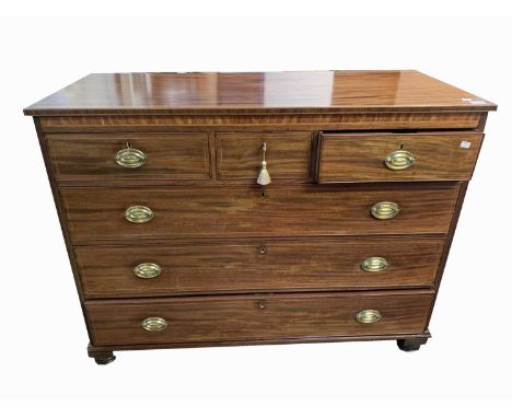 A mahogany chest of drawers, early 19th century, with three short and three long drawers, on turned feet, height 98.5cm, widt