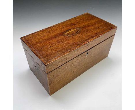 A George III period satinwood tea caddy of Sheraton design, having inlaid shell motif to the lid and ivory escutcheon, the in