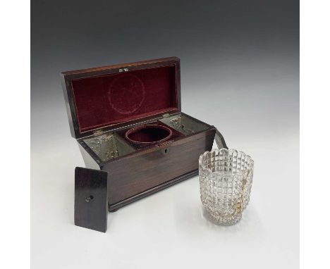 An early Victorian rosewood sarcophagus shape tea caddy, with vacant brass cartouche and containing two lidded compartments, 